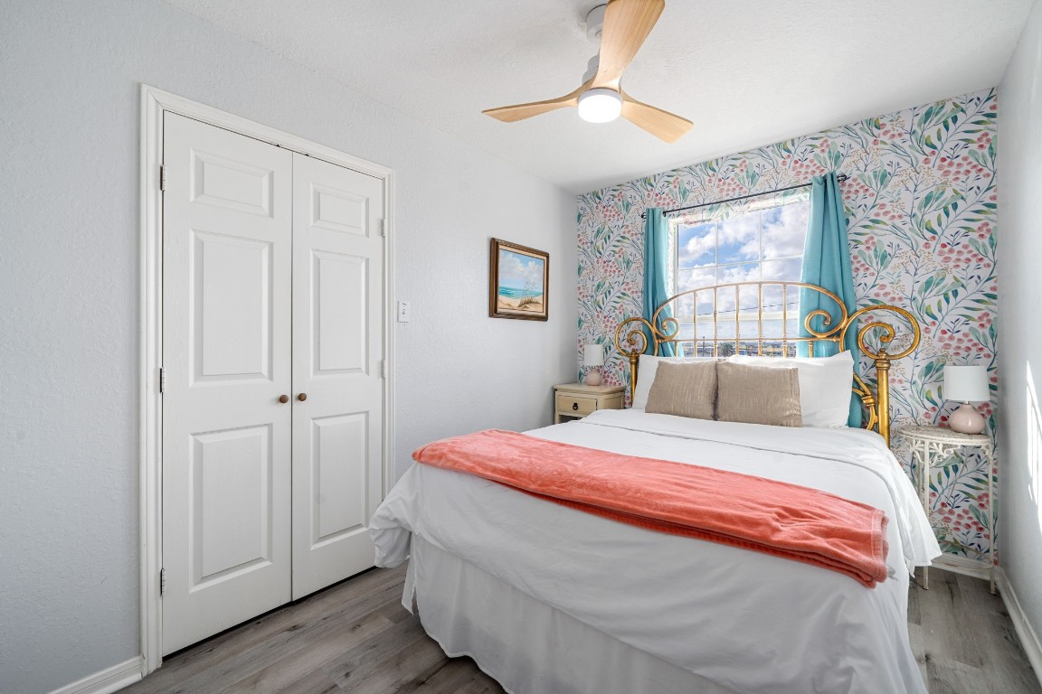 116 Starfish Street Surfside Beach, TX 77541 - Photo 36 of 49 a bedroom with a bed and a window