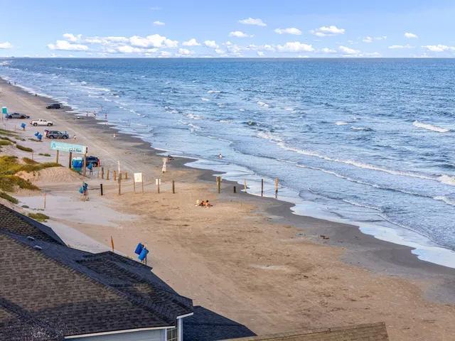 a view of a hall with wooden floor