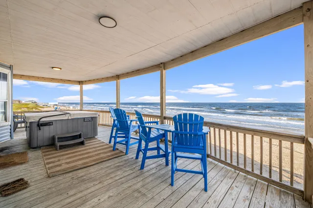 a view of a swimming pool outdoor seating and city view