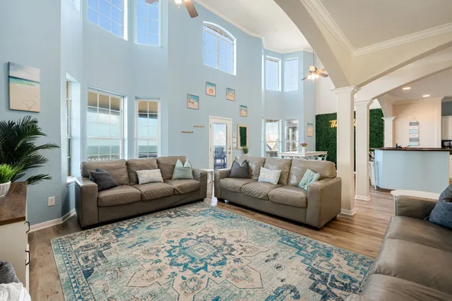 a living room with furniture and windows