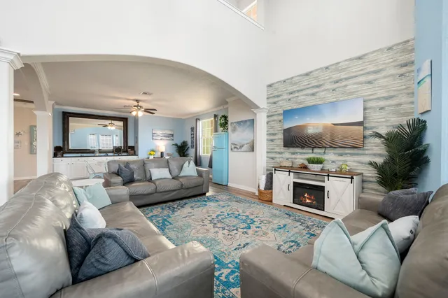 a living room with furniture and a flat screen tv