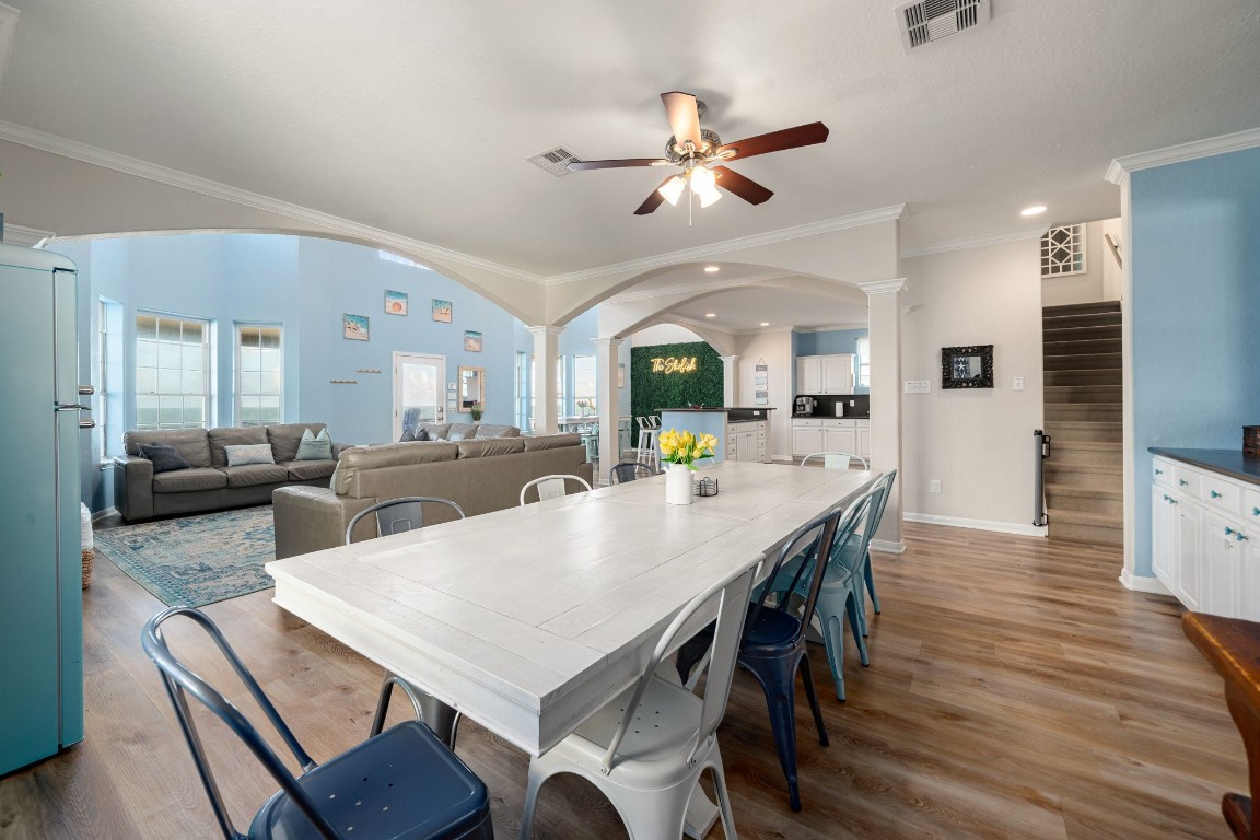 116 Starfish Street Surfside Beach, TX 77541 - Photo 10 of 49 a view of a dining room with furniture and wooden floor