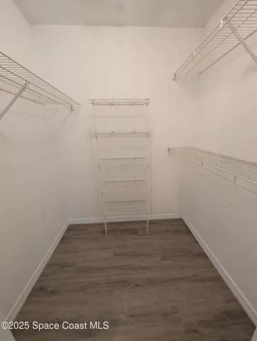 a view of an empty walk in closet