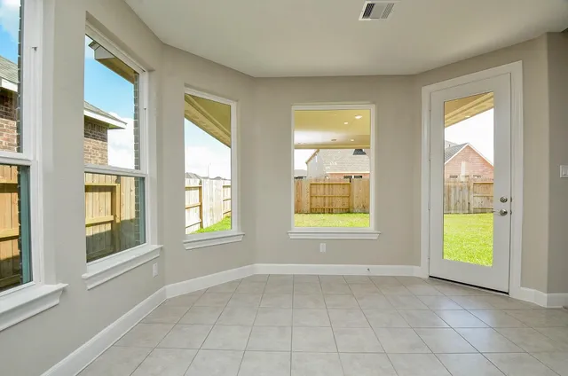 an empty room with windows