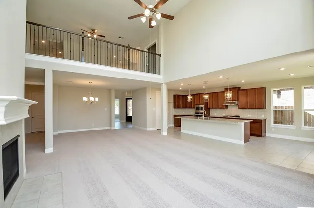 a view of a living room and kitchen view