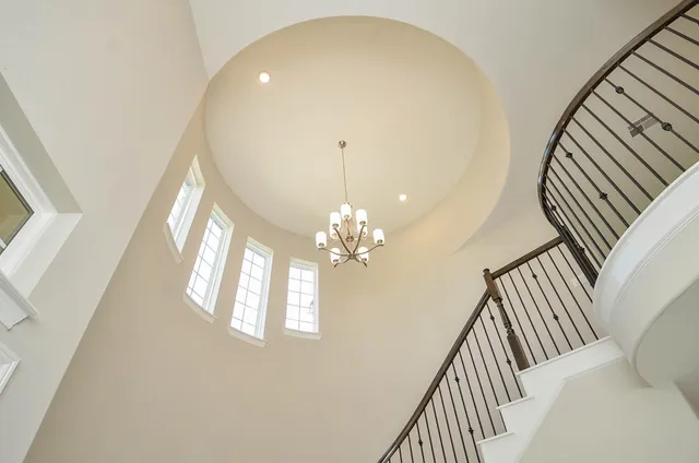 a view of a chandelier in a hallway