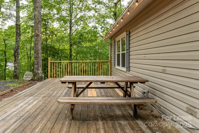 a view of balcony with wooden floor and outdoor seating