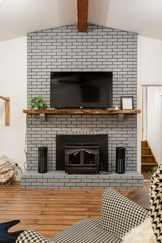 a living room with a fireplace and a fireplace