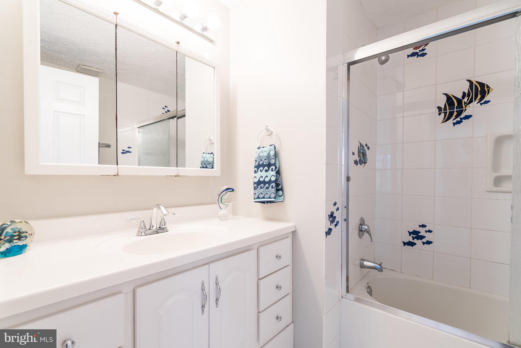 403 Rock Lodge Road Gaithersburg, MD 20877 - Photo 19 of 28 Fun guest bath with tiled floor and shower.