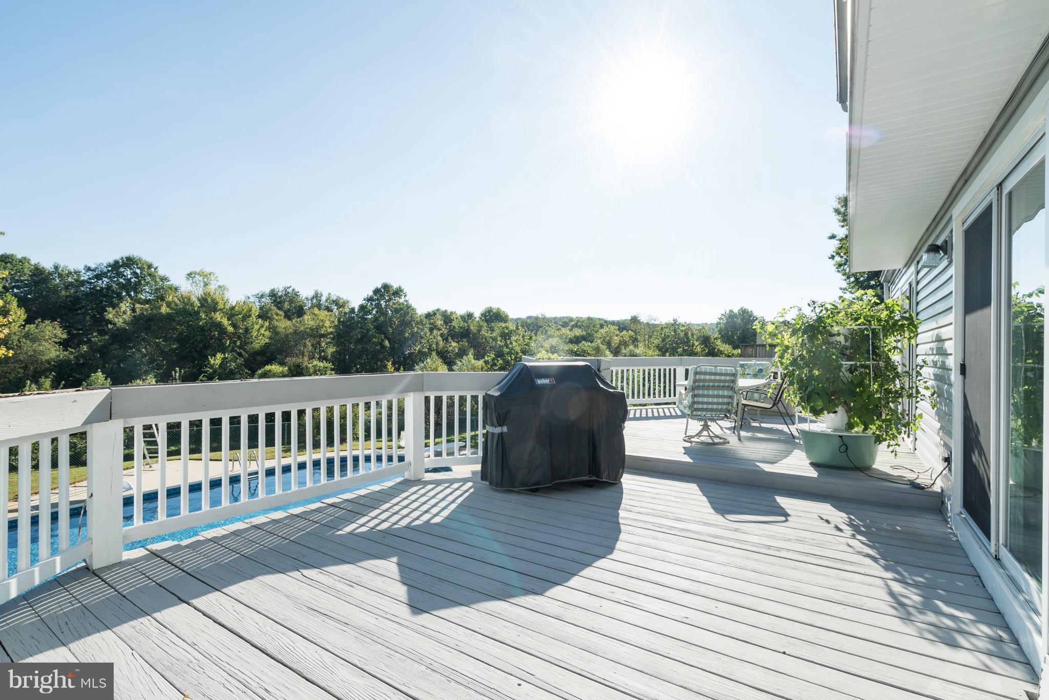 403 Rock Lodge Road Gaithersburg, MD 20877 - Photo 23 of 28 Huge deck overlooks pool and parkland.