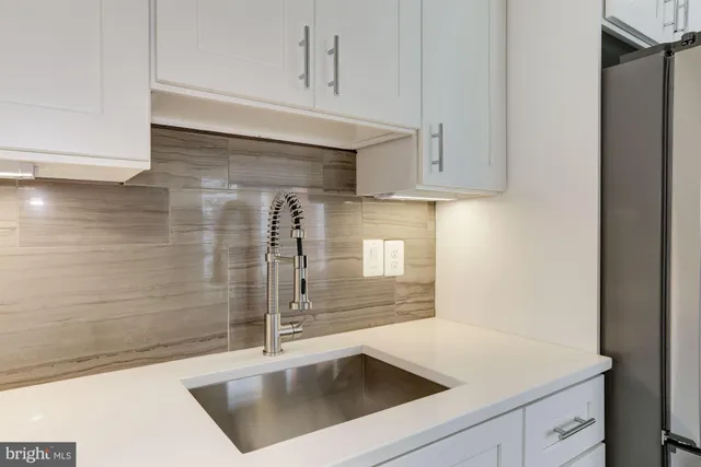 a kitchen with a refrigerator stove and microwave