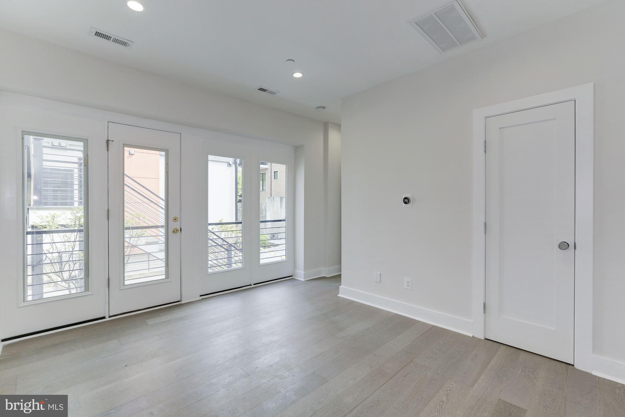 4008 Edmunds Street Northwest, Unit 9 Washington, DC 20007 - Photo 25 of 30 a view of an empty room with a window