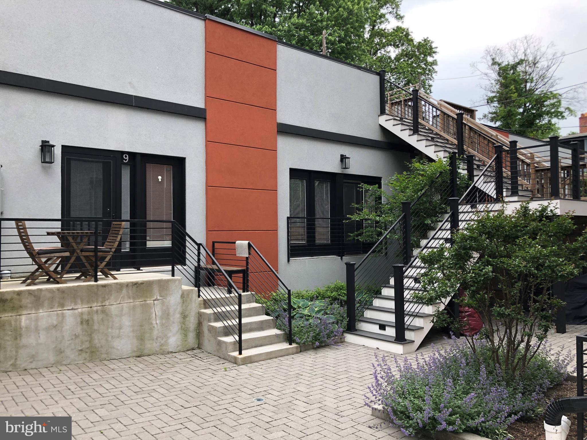 4008 Edmunds Street Northwest, Unit 9 Washington, DC 20007 - Photo 28 of 30 a view of a house with backyard and sitting area