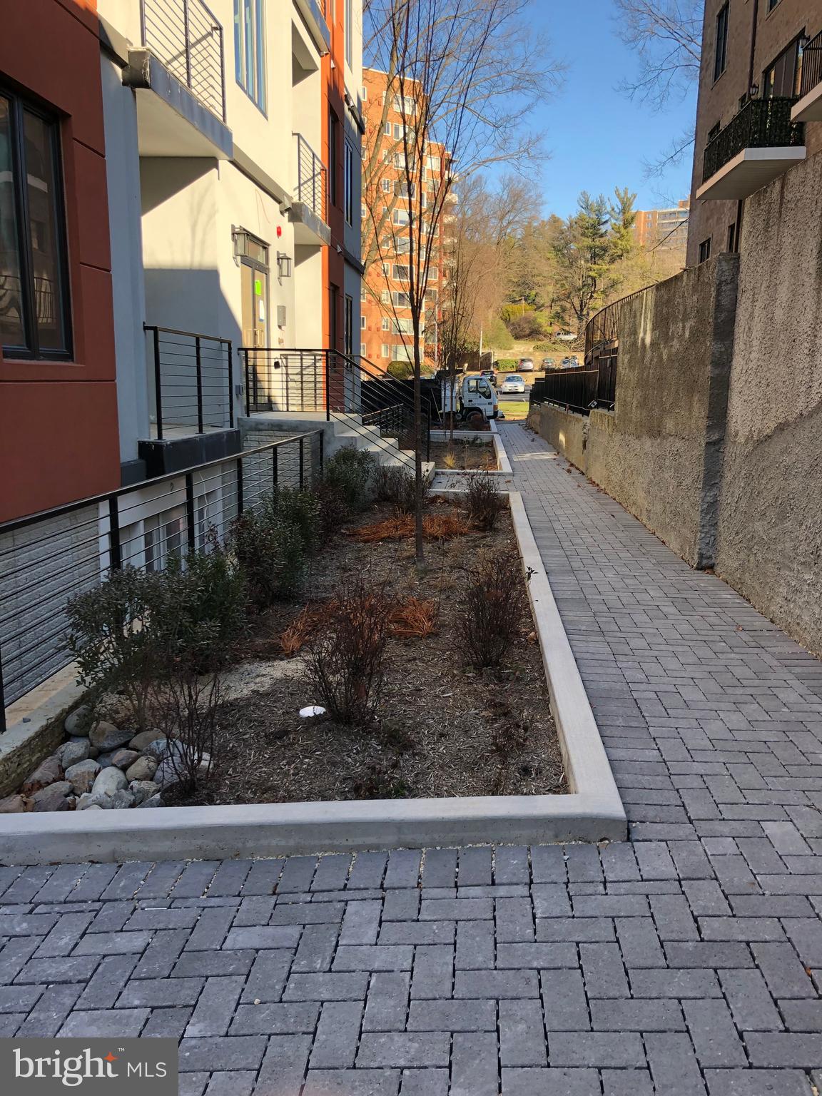 4008 Edmunds Street Northwest, Unit 9 Washington, DC 20007 - Photo 29 of 30 a view of a yard with car parked