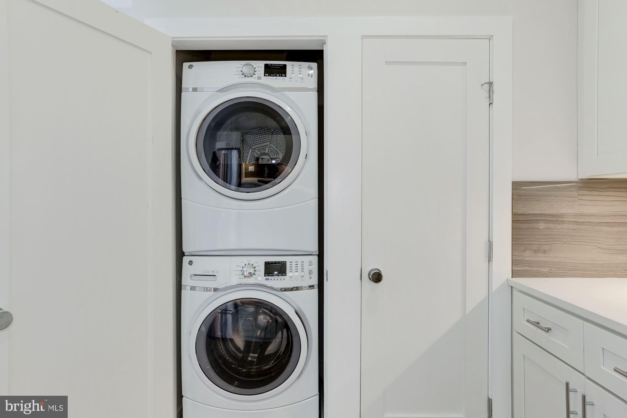 4008 Edmunds Street Northwest, Unit 9 Washington, DC 20007 - Photo 30 of 30 a view of a hallway with washer and dryer