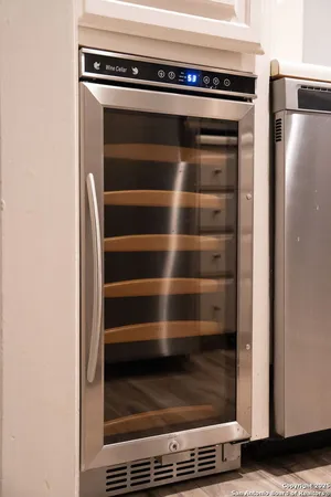a kitchen with a sink cabinets and window