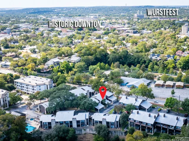 a living room with fireplace furniture and a wooden floor