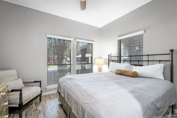 a view of a patio with table and chairs and potted plants