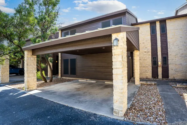 a view of a balcony with iron fence