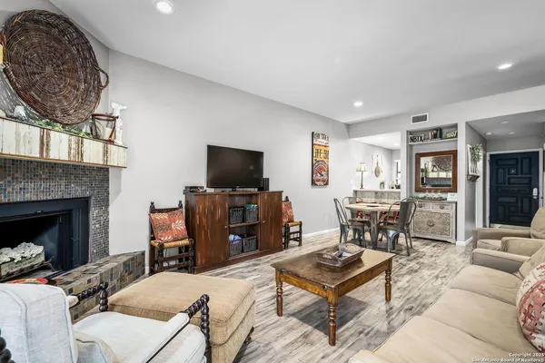 a dining room with furniture and a window