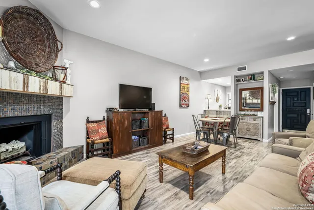 a dining room with furniture and a window