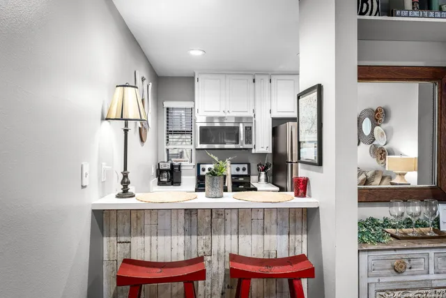 a kitchen with a sink and refrigerator