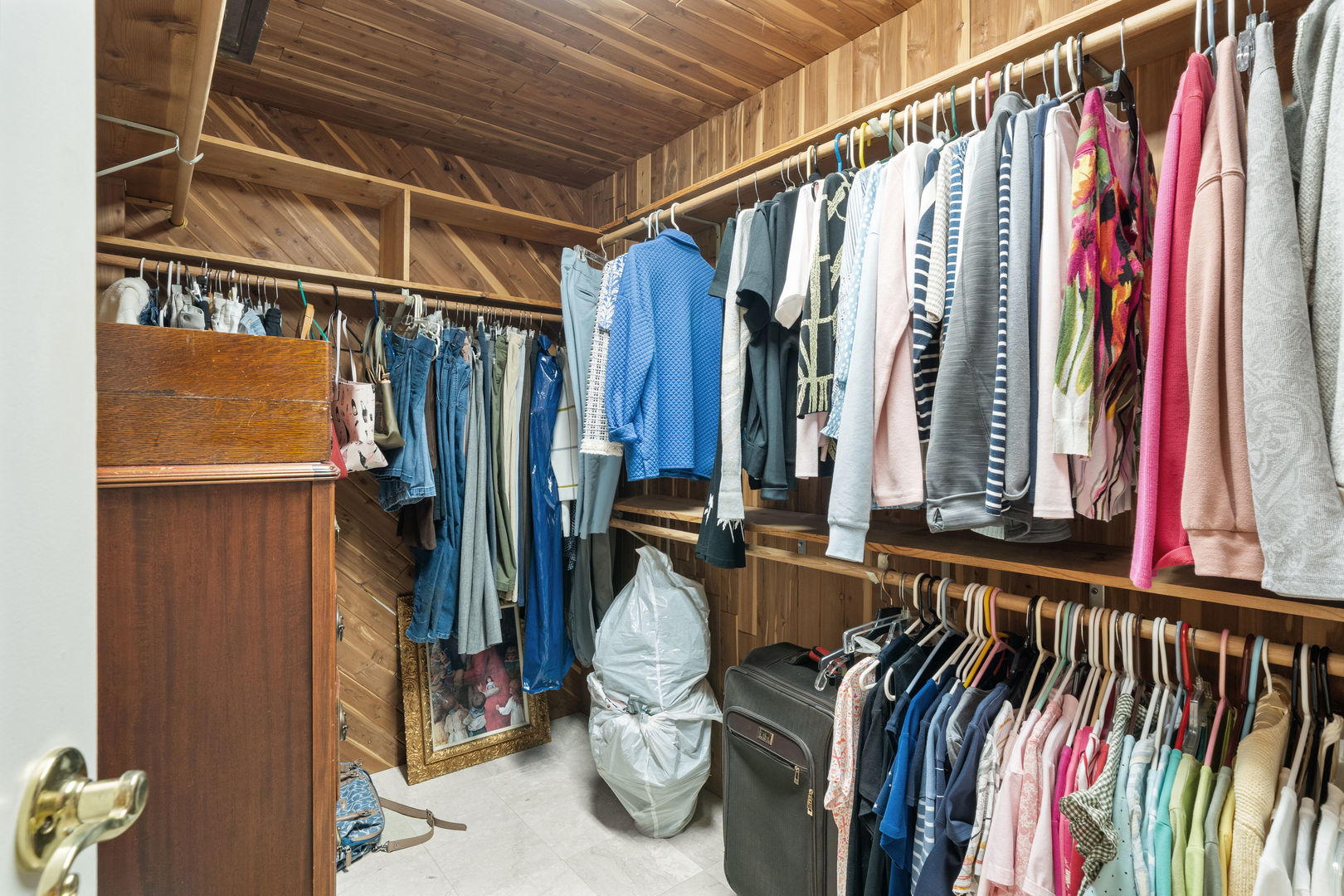 3 Oak Brook Club Drive, Unit E207 Oak Brook, IL 60523 - Photo 11 of 35 a view of walk in closet with clothes and shoes