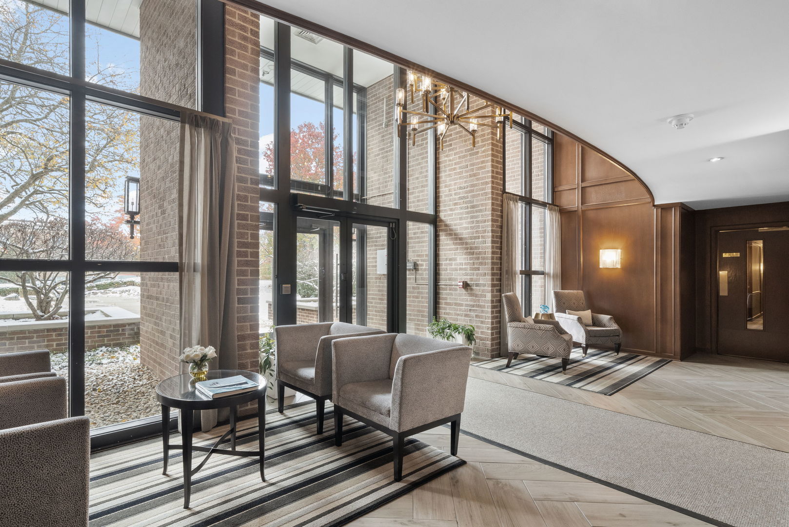 3 Oak Brook Club Drive, Unit E207 Oak Brook, IL 60523 - Photo 2 of 35 a living room with furniture and a large window