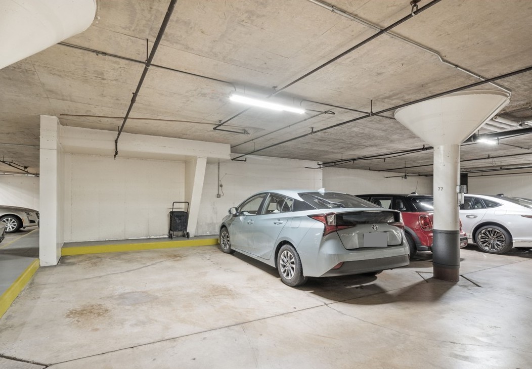 3 Oak Brook Club Drive, Unit E207 Oak Brook, IL 60523 - Photo 25 of 35 a car parked in a garage