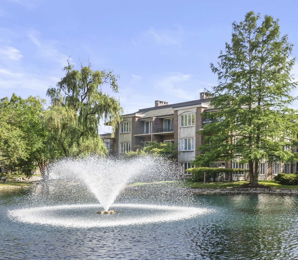 3 Oak Brook Club Drive, Unit E207 Oak Brook, IL 60523 - Photo 33 of 35 a view of a house with a yard