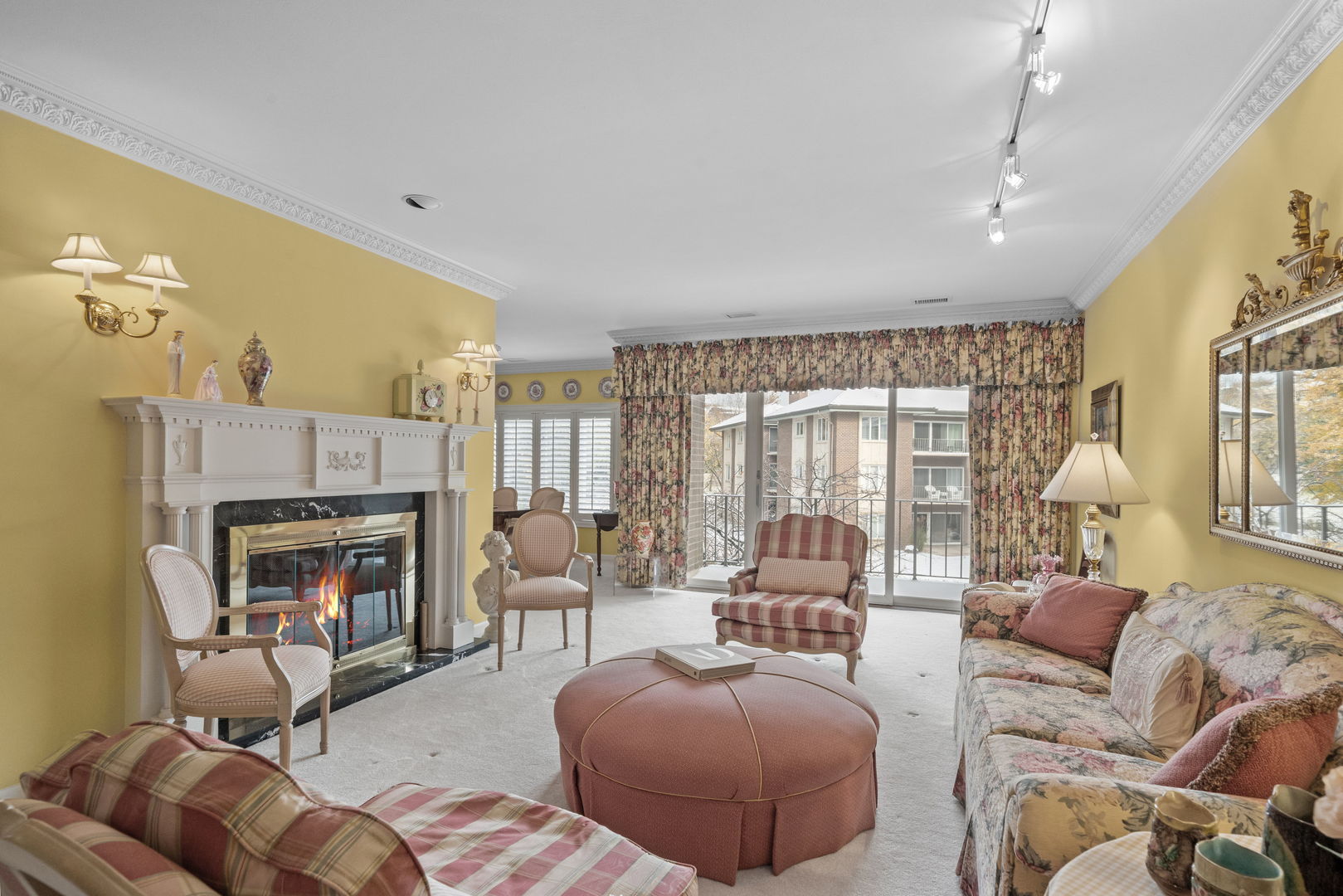 3 Oak Brook Club Drive, Unit E207 Oak Brook, IL 60523 - Photo 4 of 35 a living room with furniture and a fireplace