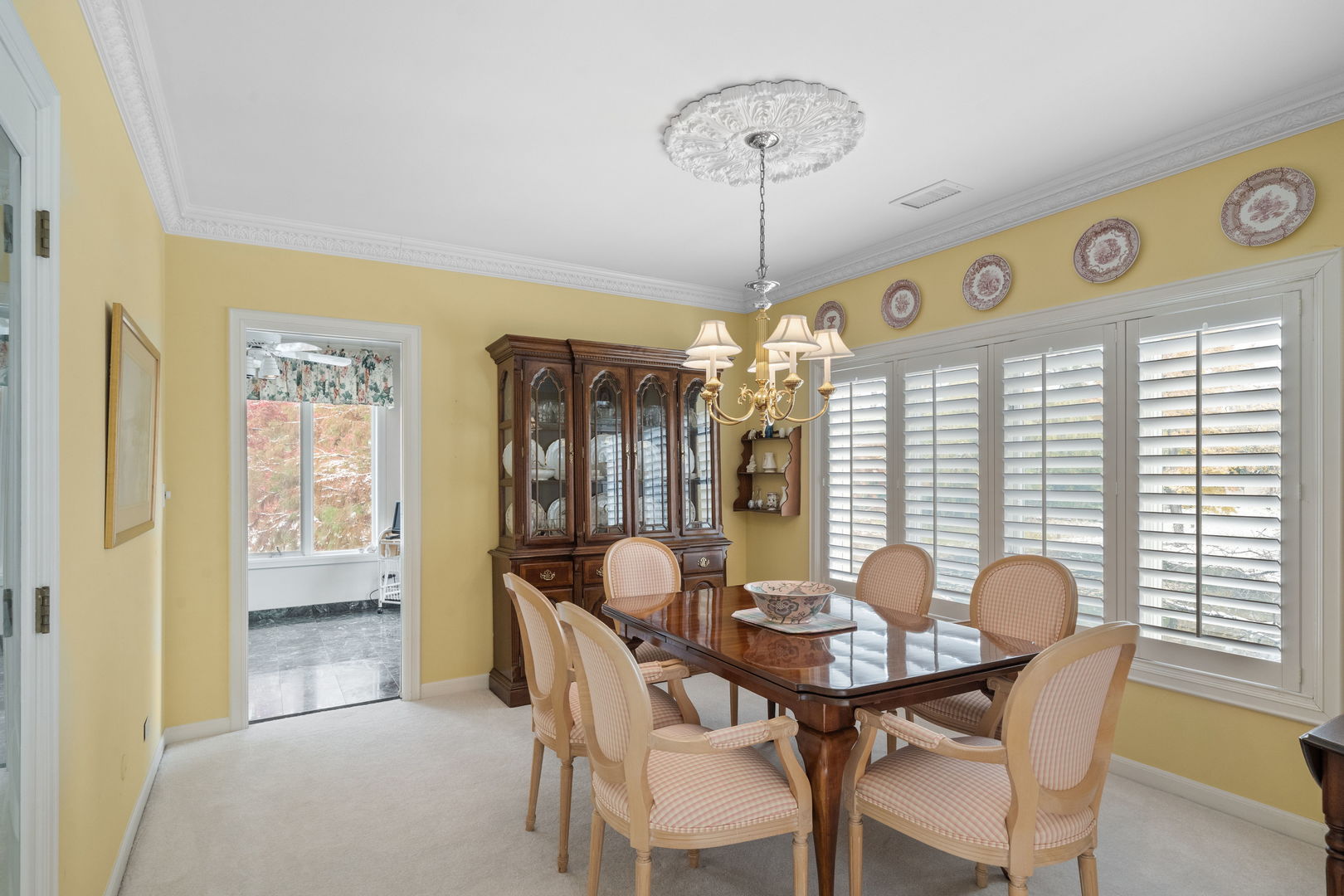 3 Oak Brook Club Drive, Unit E207 Oak Brook, IL 60523 - Photo 5 of 35 a view of a dining room with furniture wooden floor and chandelier