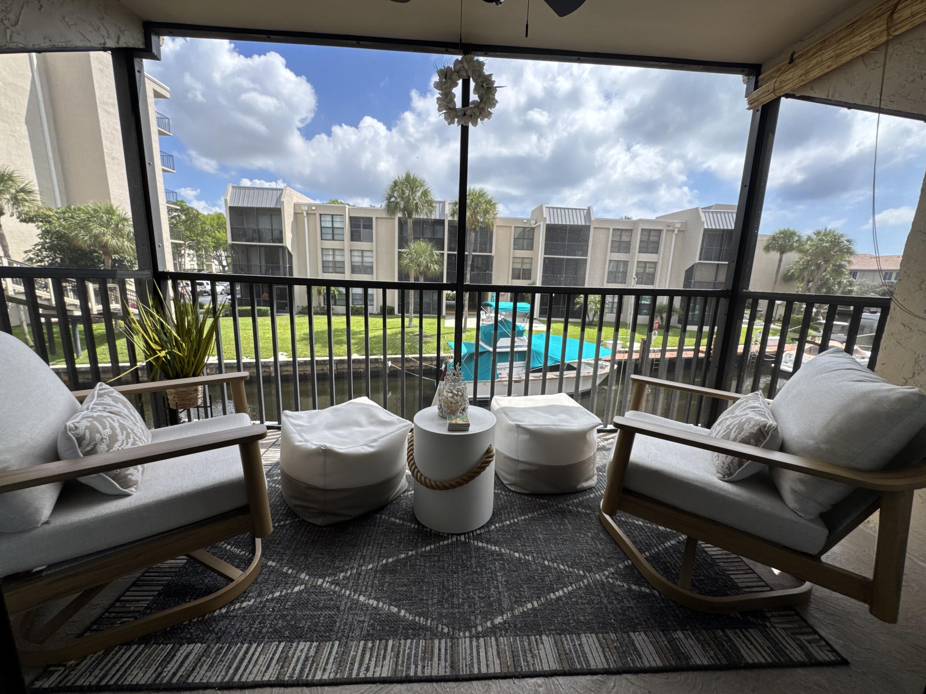 6 Royal Palm Way, Unit 202 Boca Raton, FL 33432 - Photo 22 of 29 a living room with furniture