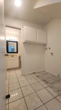 a view of a kitchen with a sink and a stove top oven