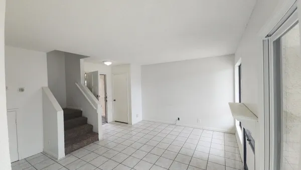 a view of a hallway with staircase