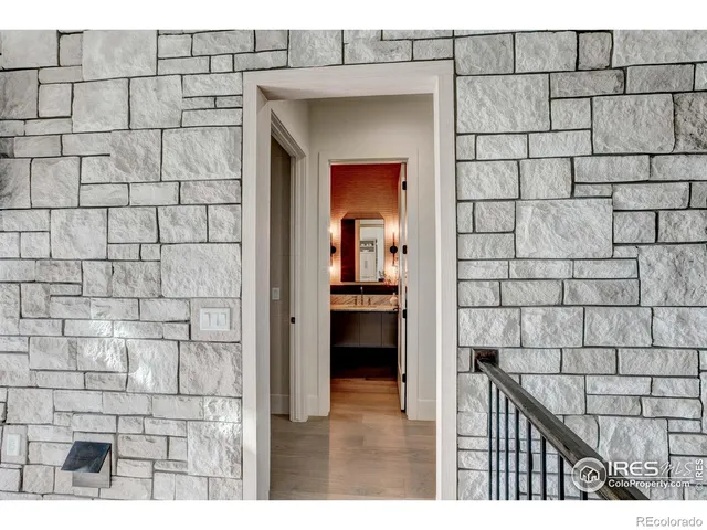 a bedroom with a large bed and a large window