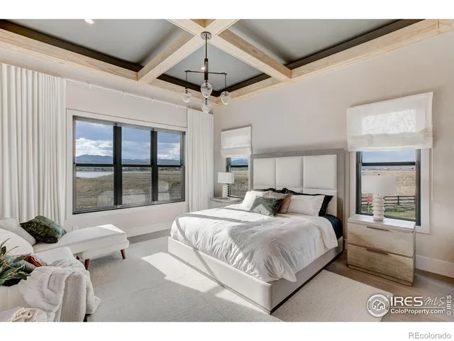 a bathroom with a granite countertop sink a mirror and shower