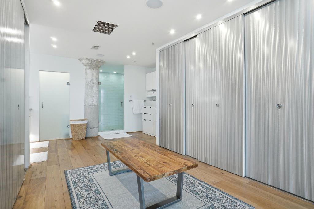 2220 Canton Street, Unit 407 Dallas, TX 75201 - Photo 20 of 39 a bathroom with a shower and a toilet