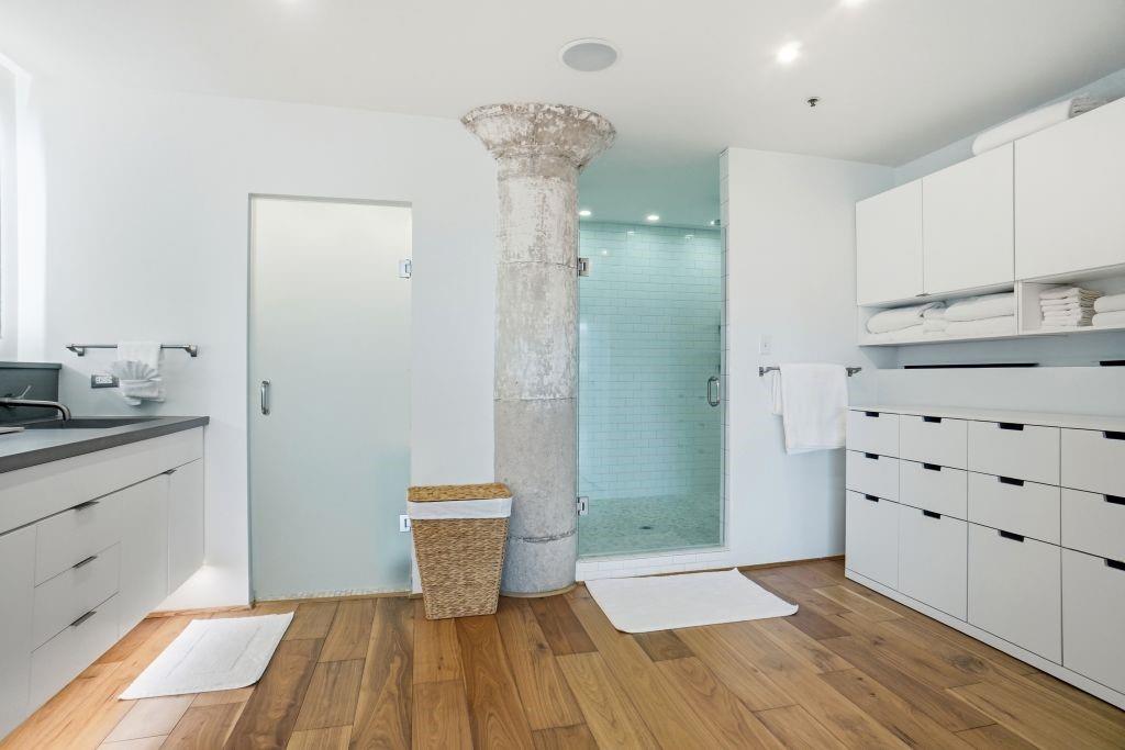 2220 Canton Street, Unit 407 Dallas, TX 75201 - Photo 22 of 39 a bathroom with a sink and a mirror