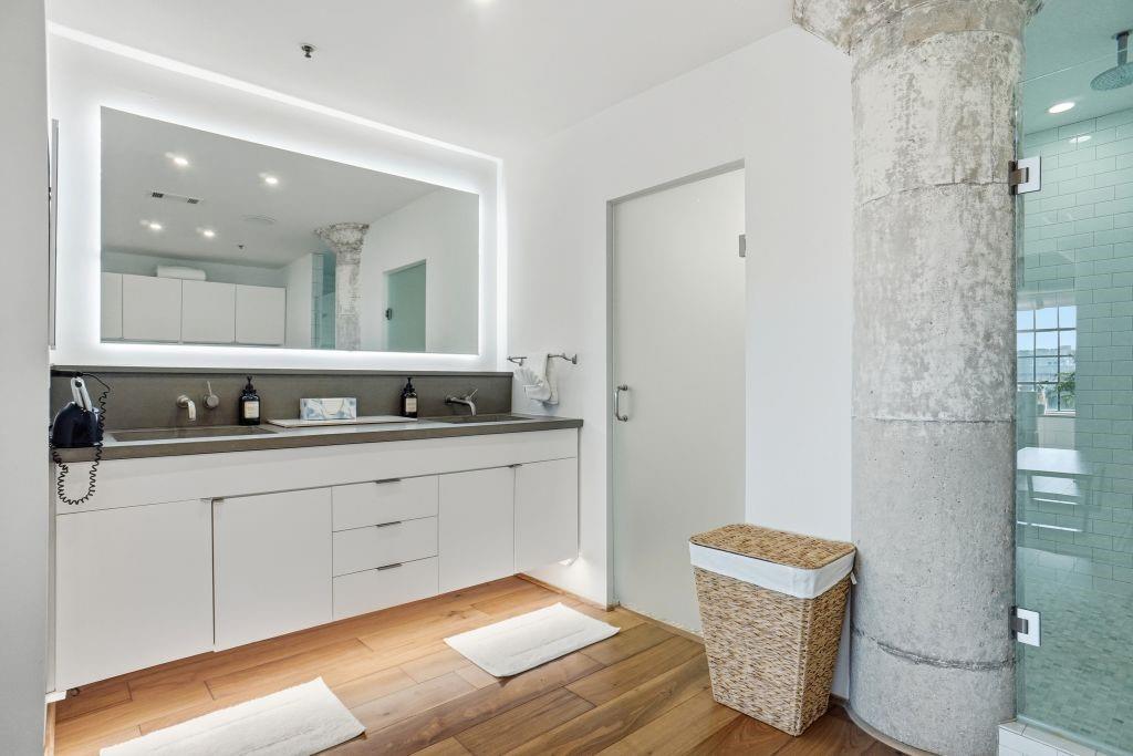 2220 Canton Street, Unit 407 Dallas, TX 75201 - Photo 23 of 39 a bathroom with a sink and a mirror