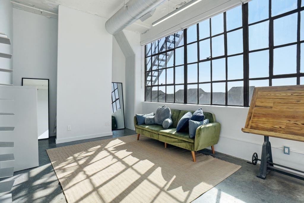 2220 Canton Street, Unit 407 Dallas, TX 75201 - Photo 25 of 39 a living room with furniture and a window