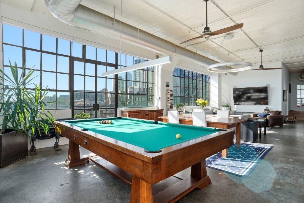 2220 Canton Street, Unit 407 Dallas, TX 75201 - Photo 5 of 39 a room with pool table and windows