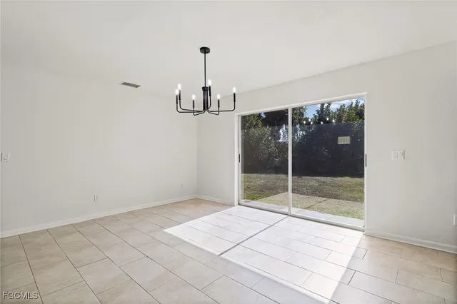 a view of empty room with floor to ceiling window