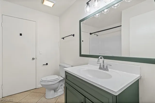 a bathroom with a sink toilet and vanity