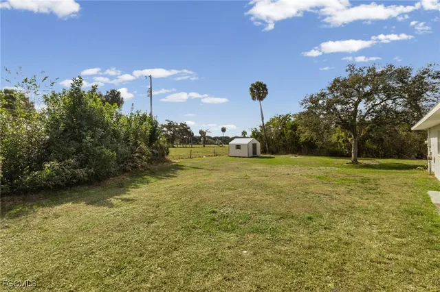 a view of a lake with a big yard