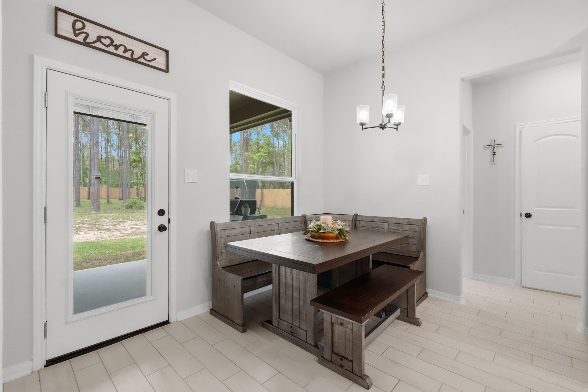 13331 Wichita Fall Trail Road Conroe, TX 77303 - Photo 12 of 22 Cozy breakfast area with natural light and easy access to the covered patio.