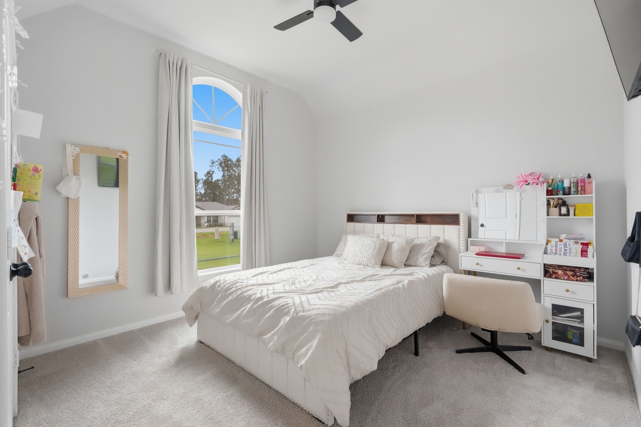 13331 Wichita Fall Trail Road Conroe, TX 77303 - Photo 18 of 22 Elegant secondary bedroom with abundant natural light.
