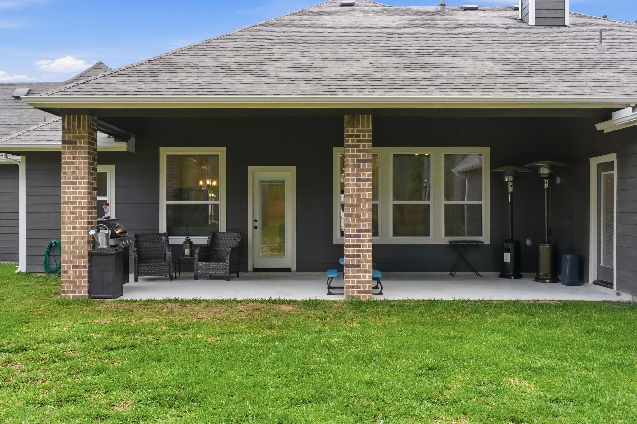 13331 Wichita Fall Trail Road Conroe, TX 77303 - Photo 20 of 22 Covered back patio with plenty of space to relax or entertain, overlooking a large, shaded backyard.