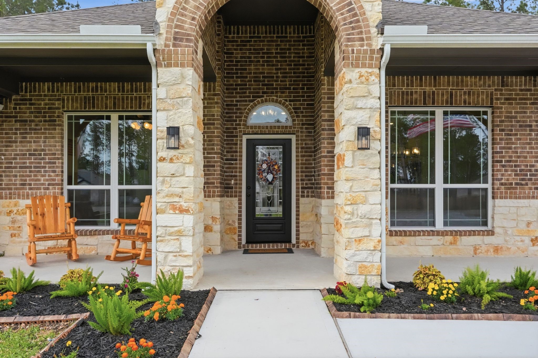 13331 Wichita Fall Trail Road Conroe, TX 77303 - Photo 2 of 22 Inviting covered front porch with stone accents and a charming entryway.