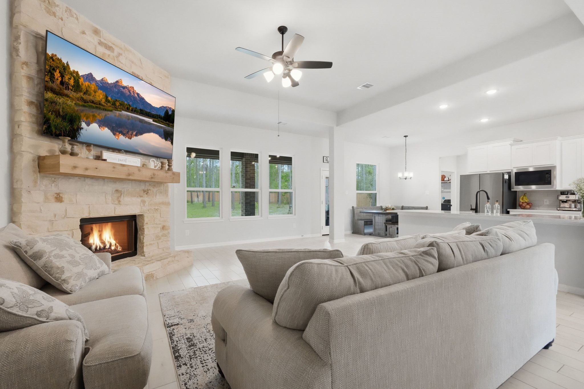 13331 Wichita Fall Trail Road Conroe, TX 77303 - Photo 6 of 22 Spacious living area with abundant natural light, seamlessly connected to the kitchen for easy everyday living and entertaining.